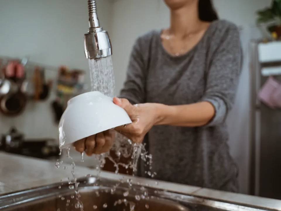 Woman washing dishes