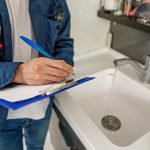 Plumber inspecting drains and sewer system