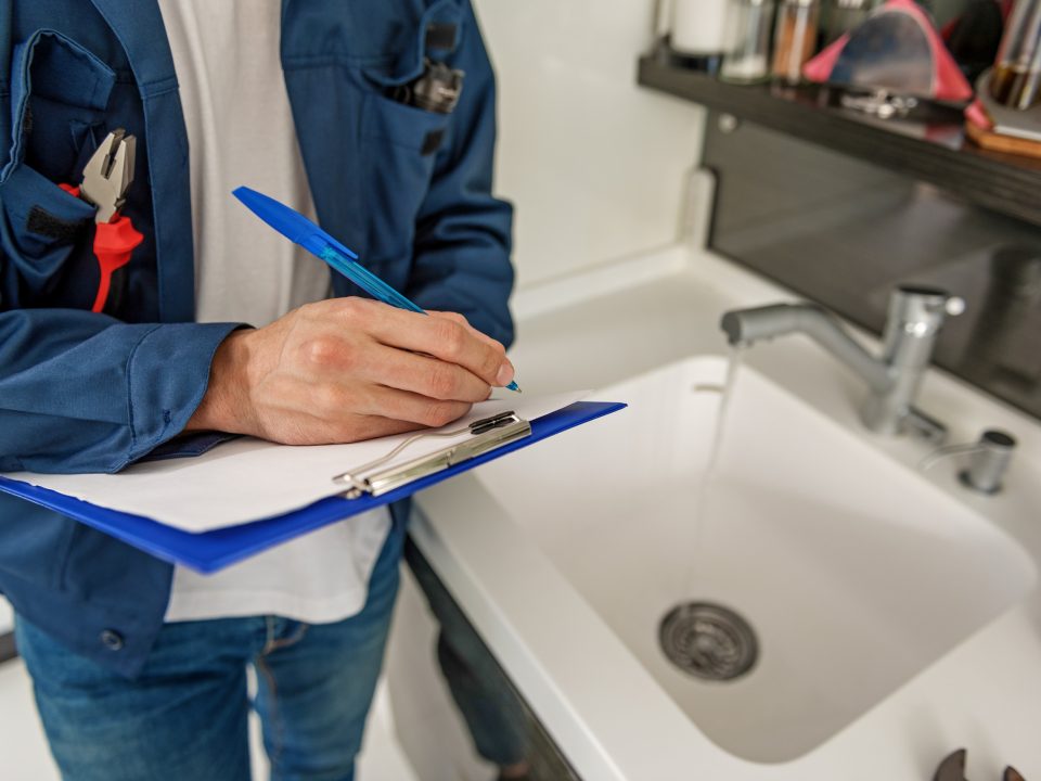 Plumber inspecting drains and sewer system