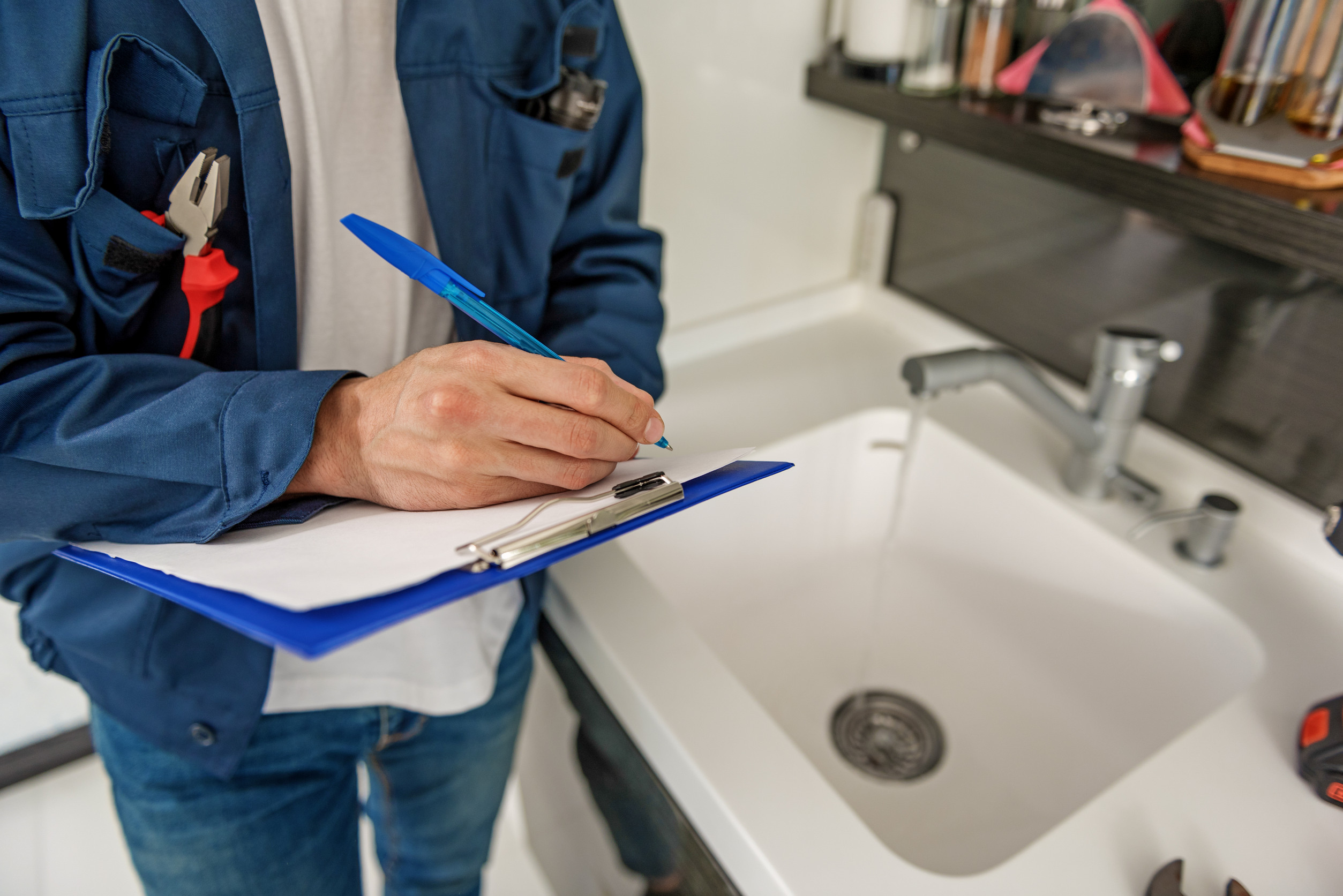 Plumber inspecting drains and sewer system