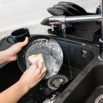 Woman washing dishes