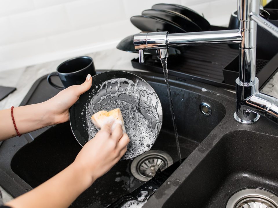 Woman washing dishes